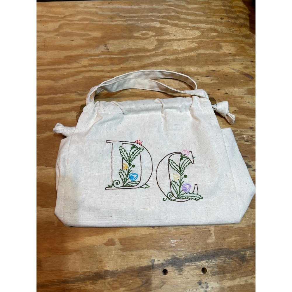 White purse with DC